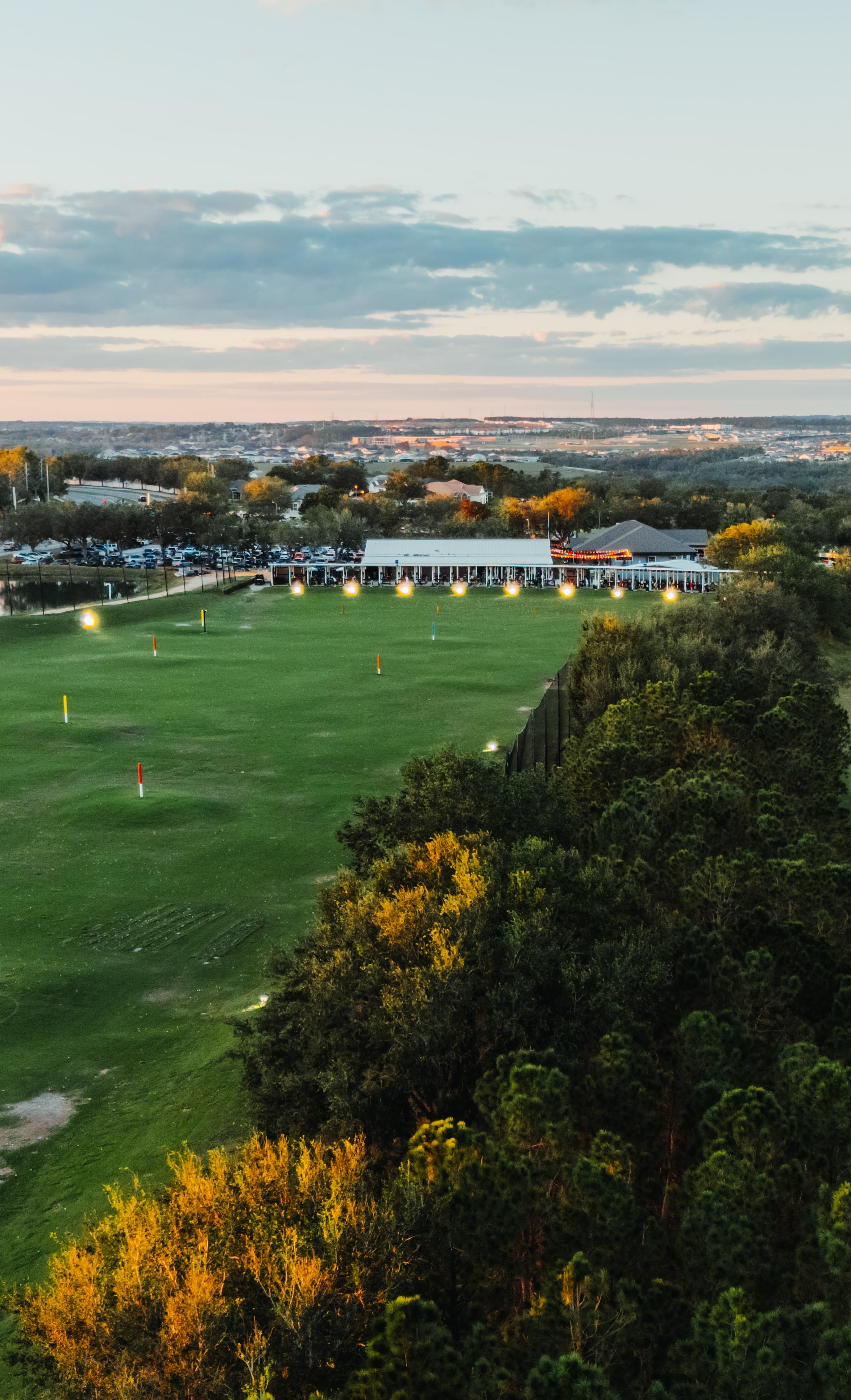 Lush fairways of Clermont National at golden hour