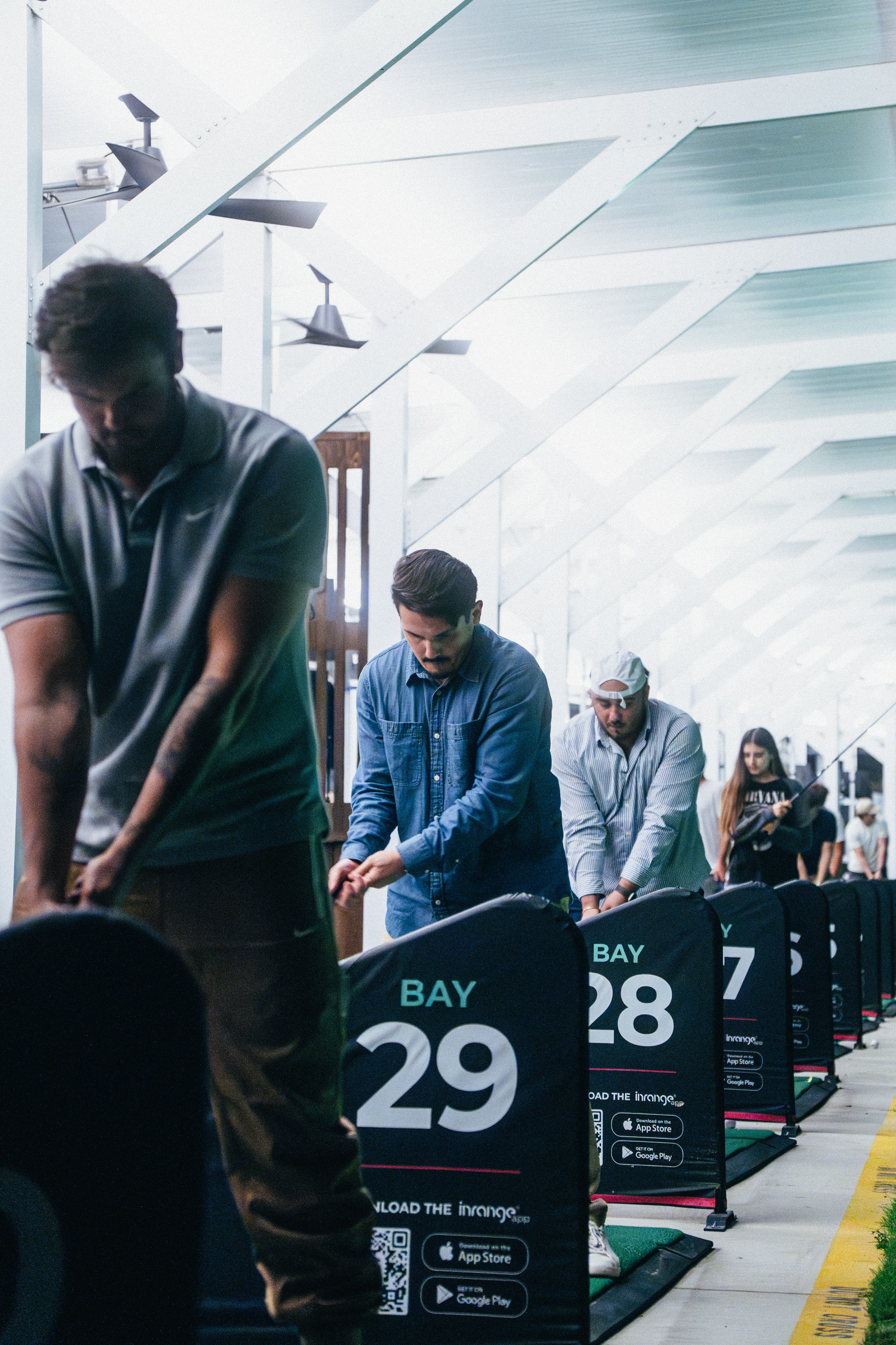 Golfers practicing at the range during the day